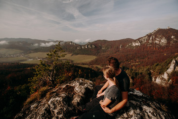 man and woman on top of mountain