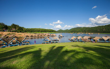 Obraz premium Water rafting with cloud blue sky in river mountain, Cottage rafts