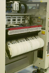 SMD components in feeders placed in SMT mounter (with ID)