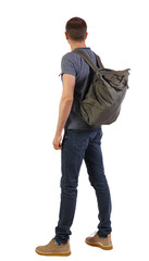 Naklejka premium Back view of a man with a green bag.