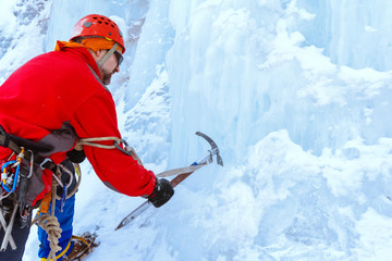 climber doing steps in the ice with an ice ax