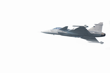 Fototapeta na wymiar The Gripen plane above the horizon