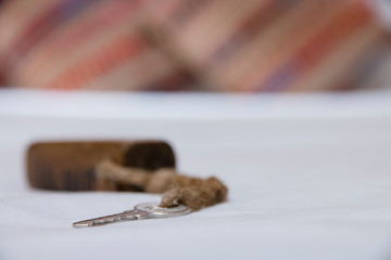 key on the bed in bedroom.
