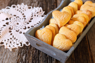 Homemade heart cookies in wooden tray