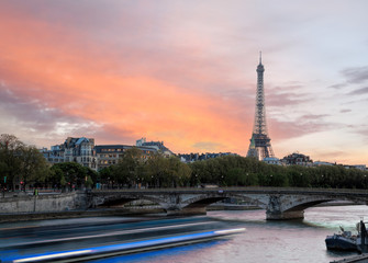 Fototapeta na wymiar Paris with Eiffel Tower against colorful sunset in France