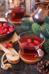 Healthy hot winter beverage. Rose hip tea and berries