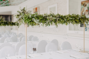 Wedding table decorated with bouquet and candles