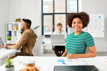 business and people concept - happy smiling african american woman at office