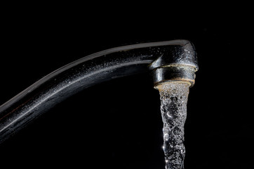 water flows from the tap