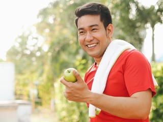 man holding an apple in his hand