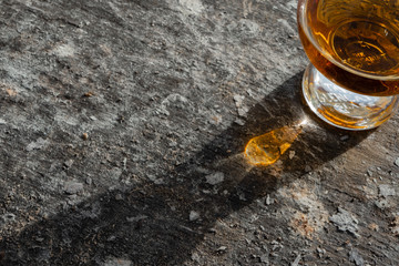 Irish Whiskey Glass Sunshine and Shadow on Slate Medium Shot
