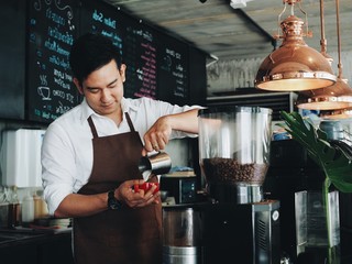 bartender pouring beer in a bar
