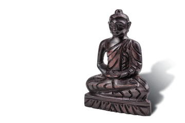 Wooden statue of Buddha on white