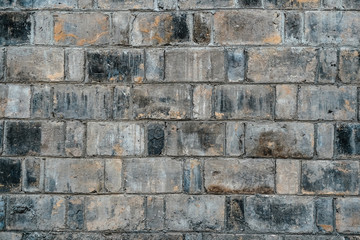 Background of old vintage black and gray dirty brick wall texture