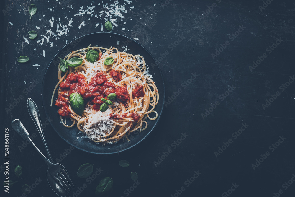 Wall mural delicious appetizing classic spaghetti pasta with tomato sauce, parmesan