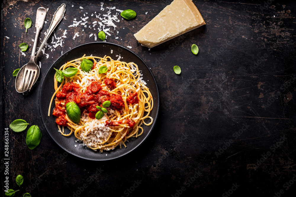 Wall mural delicious appetizing classic spaghetti pasta with tomato sauce, parmesan