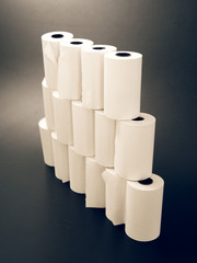 tape of white paper for cash on a black background.