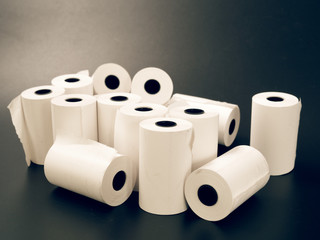 tape of white paper for cash on a black background.