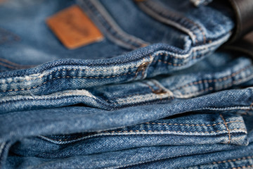 Naklejka premium Blue jeans. Fragment of shabby cotton. Selective focus.