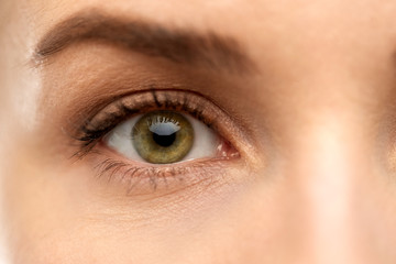 vision, sight and people concept - close up of woman eye
