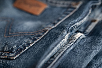 Blue jeans. Fragment of shabby cotton. Selective focus.