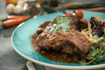 juicy grilled pork leg with fresh salad