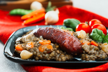 Homemade Sausage Cooked lentils with baby onions and carrots