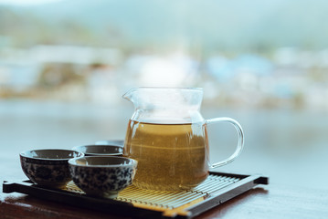 Pouring tea in glass cup,Vintage style