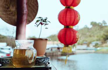 Pouring tea in glass cup,Vintage style