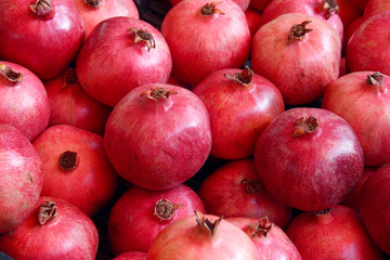 many juicy pomegranates 