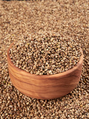 Bowl of hemp seeds. Bird food.