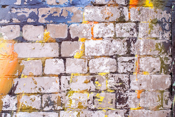old brick wall with paint and plaster residues