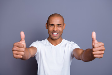 Close up photo strong healthy teeth dark skin he him his guy bald head approve show thumbs fingers...