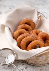 many donuts in a wicker basket, home baking, rustic style