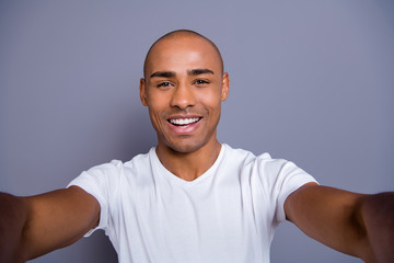 Close up photo healthy masculine dark skin he him his macho bald head arms telephone make take...
