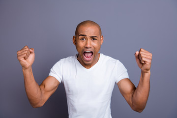 Close up photo strong healthy dark skin he him his macho bald head mouth opened in delight yell in...