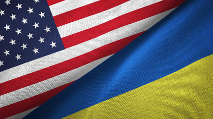 United States and Ukraine two flags textile cloth, fabric texture