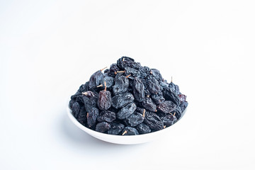 Black currant dried on white background