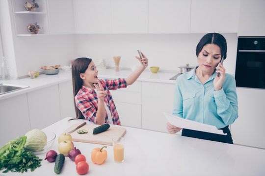 Portrait of two nice lovely attractive stylish trendy people funny girl showing v-sign lady talking about data analysis in light white kitchen interior indoors