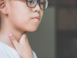 Little ill boy get sore throat with unhappy. Allergy concept