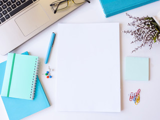 Home office workspace mockup.Workspace top view, copy space.White desk office with blank notebook, computer and other office supplies. Flat lay, top view office table desk.Minmal workspace.