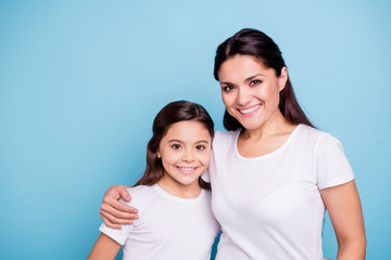 Close up photo amazing pretty two people brown haired mum small little daughter stand hugging...