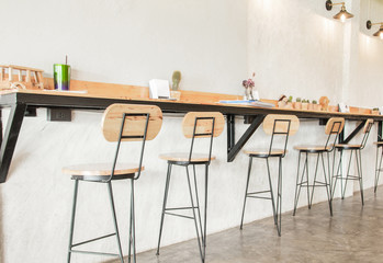 Empty on people . Coffee shop interior design With chairs and white walls.