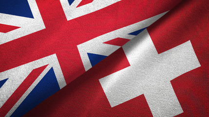 United Kingdom and Switzerland two flags textile cloth, fabric texture