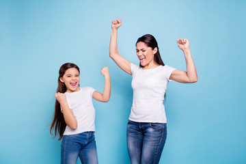 Close up photo cheer pretty two people brown haired mum small little daughter  arms up in air...