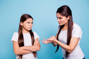 Close up photo two people brown haired mum small little daughter hands arms raised aggressive...