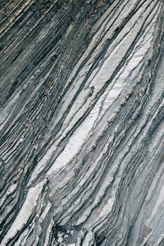 Closeup rough surface of gray rock cliff in Spanish countryside