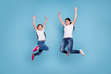 Full length body size view of two nice-looking cute lovely winsome attractive cheerful cheery slim sporty people wearing white t-shirt raising hands up isolated over blue pastel background