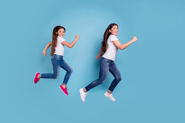 Fototapeta na wymiar Full length body size profile side view of two nice sweet lovely attractive cheerful cheery funny slim sporty people in white t-shirt having fun isolated over blue pastel background