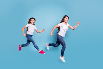 Fototapeta na wymiar Full length body size profile side view of two nice crazy sweet lovely attractive cheerful funny slim people in white t-shirt jeans denim rush hour isolated over blue pastel background